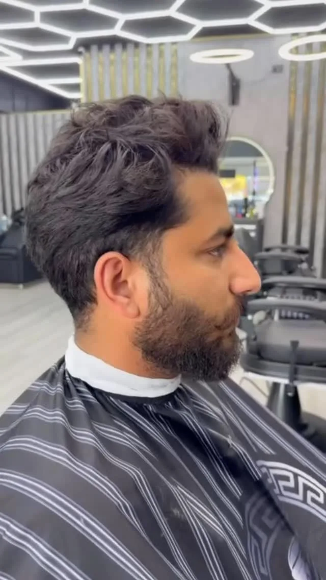Textured quiff with full beard blend, hexagon ceiling