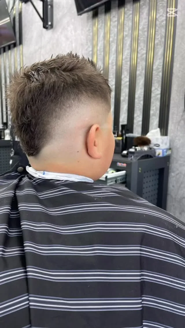 Kids' burst fade with spiky top, gold slat wall